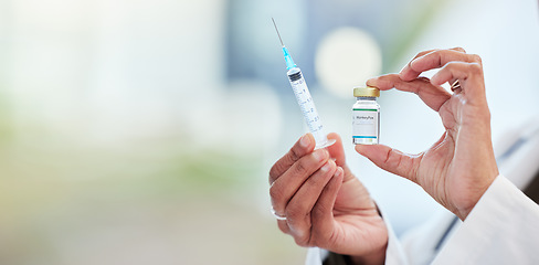 Image showing Vaccine bottle, needle and hands of doctor in a medicare hospital getting ready for a monkeypox treatment. Healthcare, injection and closeup of a medical worker with a virus vaccination in a clinic.