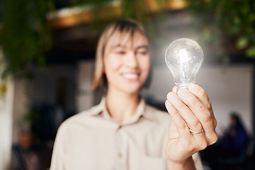 Image showing Lightbulb, happy and a woman with light from inspiration, knowledge or ideas at work. Smile, innovation and an employee with power, creativity and energy at a company with optimism and vision