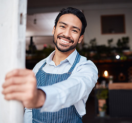 Image showing Happy, portrait and male entrepreneur of a cafe standing by the door to welcome customers. Confident, proud and face of a young man small business owner with success at his modern startup coffee shop