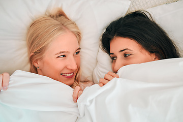 Image showing Love, above and lesbian couple in bed, waking up and bonding in their home together. Lgbt, gay and happy women sharing romance, relationship and sweet moment in a bedroom, in love and content