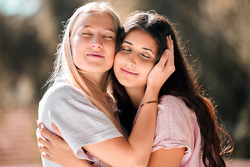 Image showing Hug, happy and women with comfort and embrace in nature for bonding, appreciation and support. Smile, caring and friends or gay couple hugging with affection in a garden or park for care and love
