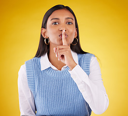 Image showing Portrait, secret and woman with finger on lips, private and whisper on a studio background. Face, female person or girl with gesture for quiet, silence and secrecy with privacy sign, gossip and emoji