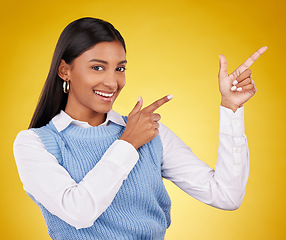 Image showing Woman, portrait and gun fingers in a studio pointing with emoji hand gesture with a smile. Happiness, business female and happy youth with proud and cool hands sign in isolated yellow background