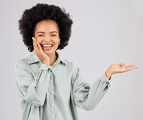 Image showing Portrait, product placement and black woman smile in studio isolated on a white background. Hand, space and happiness of person with advertising, marketing or branding, mockup or commercial promotion