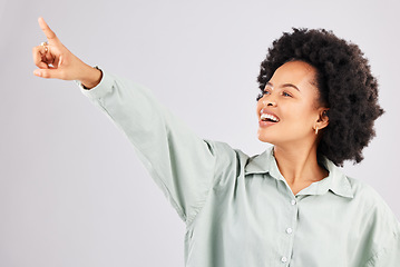 Image showing Point, happy and black woman in studio smile with hand gesture for news, announcement and deal. Mockup space, white background and isolated girl pointing for promotion, product placement and showing