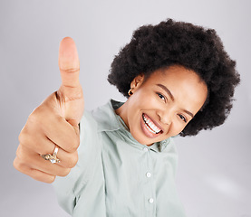 Image showing Portrait, thumbs up and black woman top view in studio isolated on a white background. Success, happiness and person with hand gesture or emoji for winning, approval or agreement, like or thank you.