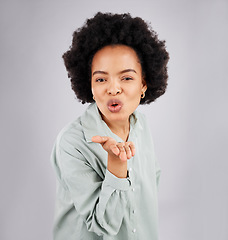 Image showing Portrait, woman and blowing kiss in studio, white background and backdrop of love, care or flirt. Face of happy female model, hands and kissing emoji for romance, happiness or smile on valentines day