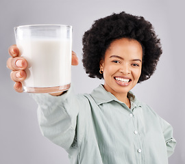 Image showing Portrait, happy woman and glass of milk in studio, white background and backdrop for healthy diet. Female model, food and calcium of smoothie, vanilla milkshake and nutrition of weight loss drink