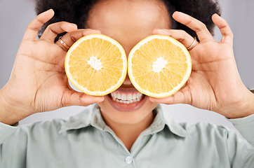 Image showing Lemon eyes, health and face of black woman in studio for nutrition, wellness and healthy snack. Food, diet and girl smile with organic fruit for detox, vitamins and weight loss on white background