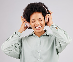 Image showing Music headphones, black woman and singing in studio isolated on a white background. Singer, radio and happiness of person listening, streaming or enjoying audio track, sound album or podcast song.