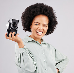 Image showing Portrait, camera photographer and black woman smile in studio isolated on a white background. Photography, professional and happy person or female ready to start filming, photoshoot or taking picture