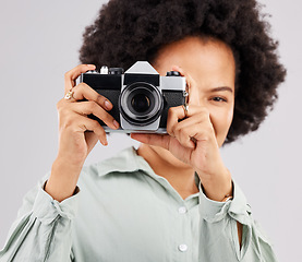 Image showing Portrait, camera photographer and black woman in studio isolated on a white background. Photography, professional and person or female ready to start filming, photoshoot or taking paparazzi picture.
