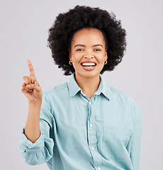 Image showing Woman portrait, thinking and idea with a smile in a studio with a solution to a question with happiness. Isolated, gray background and female feeling happy and confident from inspiration and ideas