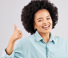 Image showing Portrait, thumbs up and black woman laughing in studio isolated on a white background. Success, happiness and person with hand gesture or emoji for winning, approval or agreement, like or thank you.