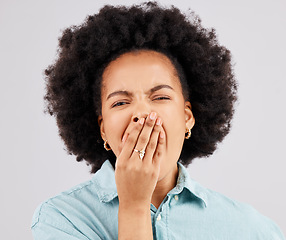 Image showing Yawning, studio and portrait of a woman tired with insomnia and sleep problem. Isolated, white background and fatigue of a young and female model lazy and ready for sleeping and rest covering mouth