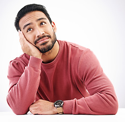 Image showing Thinking, man and relax in a studio with looking attractive and handsome at mockup. Isolated, white background or resting male model feeling calm or relaxing with ideas, dreaming or creative thoughts