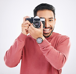 Image showing Happy, photographer and portrait of Asian man with a camera isolated on a white background in studio. Smile, work and a Japanese journalist in photography taking pictures for the media or paparazzi