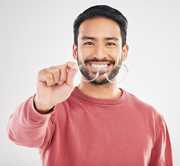 Image showing Glasses, happy man and portrait in a studio with a smile from vision showing eye care product. Isolated, white background and happiness of a Asian male model with lens prescription and frame check