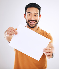 Image showing Studio poster mock up, portrait and happy man with marketing placard, advertising banner or product placement paper. Logo mockup, billboard promo sign and branding person isolated on white background