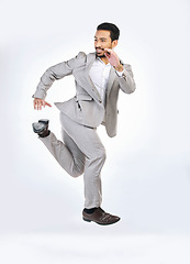 Image showing Running, rush and business man late for work jumping, hurry and sprint for appointment in studio. Corporate mockup, time management and Asian male isolated on white background in run to workplace