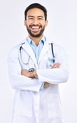 Image showing Portrait, doctor and Asian man with arms crossed, smile and confident guy isolated on white studio background. Face, male employee and medical professional with leadership, experience and healthcare