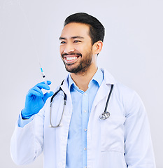 Image showing Doctor with smile, syringe and vaccine in studio for healthcare, medicine and medical innovation. Vaccination, booster shot and happy Asian man with needle for virus protection on white background.