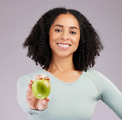 Image showing Happy woman, portrait and smile with apple for diet, natural nutrition or vitamins against white studio background. Female model smiling and holding organic fruit in healthy dieting, food or wellness