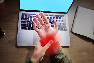 Image showing Wrist pain, hands and woman at desk with laptop, green screen and mockup with injury and red overlay. Palm, muscle tension and anatomy with health, female working night with carpal tunnel and injured