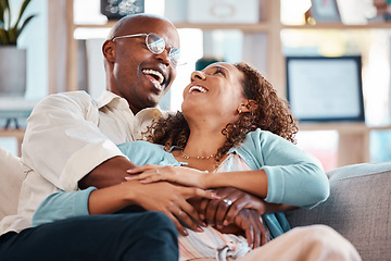 Image showing Love, happy and couple laugh on sofa for bonding, quality time and relaxing together at home. Marriage, relationship and black man and woman on couch embrace, hugging and laughing for funny joke