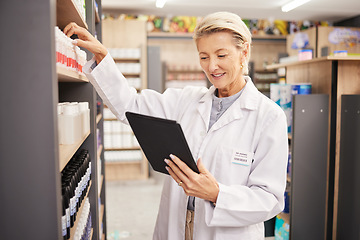 Image showing Pharmacist, stock or woman with tablet, check inventory or medication information with technology. Mature female, lady or medical professional with device, pharmacy or supplements with online reading