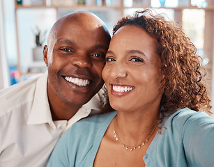 Image showing Selfie, happy and portrait of couple in home for bonding, quality time and relax together in living room. Love, relationship and interracial man and woman smile for picture for social media or memory