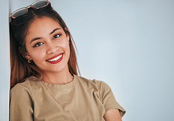 Image showing Happy, smile and portrait of a woman in a studio with a casual, fashion and trendy outfit. Happiness, excited and face of a female model from Puerto Rico with a positive mindset by a gray background.