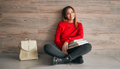 Image showing University, portrait of woman with books and smile on floor, education at college on wall background mockup. Information, knowledge and space, student with backpack and happiness with book to study.