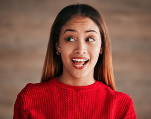 Image showing Surprise, excited and face of woman with smile on wall background for good news, announcement and sale. Red fashion, beauty and happy girl with cosmetics for advertising, marketing and discount