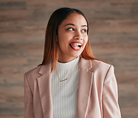 Image showing Happy, beautiful and female with her tongue out by a wall with a positive, goofy and confident mindset. Happiness, comic and excited young woman model from Mexico with a silly funny face expression.