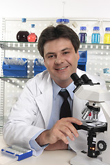 Image showing Researcher scientist  sitting at laboratory desk