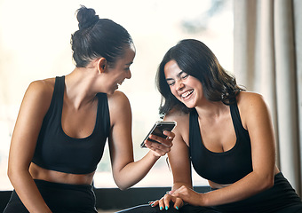 Image showing Fitness, funny and women with smartphone, exercise and fun after workout, training and friends. Female athletes, girls and partners with cellphone, meme or social media with smile, practice and break