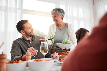 Image showing Family, dinner and party with happiness while eating together, love and food with celebration and holiday. Man with senior woman, relationship and hungry people with meal, happy and carefree