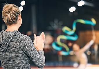 Image showing Coaching, gymnastics and clapping with woman in stadium for training, fitness and teaching. Celebration, sports and workout practice with coach and acrobat for performance, flexibility and show