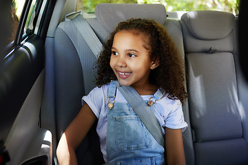 Image showing Road trip, girl child and happy in car backseat for travel, journey and drive, happy and relax. Smile, kid and little passenger enjoying drive in vehicle for adventure, vacation or weekend traveling
