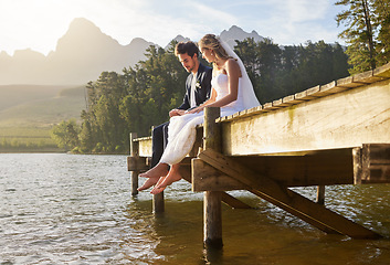 Image showing Wedding, lake and couple in nature for marriage ceremony, commitment and trust outdoors. Love, relationship and man and woman bonding on honeymoon for partnership, romantic holiday and celebration