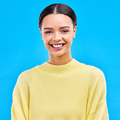 Image showing Happy, fashion and portrait of woman in studio for relax, beauty and natural makeup. Cosmetics, mindset and happiness with face of female isolated on blue background for glow and cool satisfaction