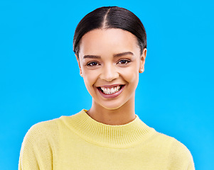 Image showing Happy, smile and portrait of woman in studio for relax, beauty and natural makeup. Cosmetics, mindset and happiness with face of female isolated on blue background for glow, cool and satisfaction