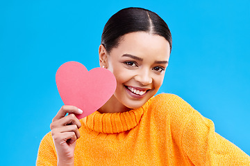 Image showing Paper heart, happy woman and portrait on blue background, studio and backdrop. Female model, smile and shape of love, trust and support of peace, thank you and kindness on valentines day for romance