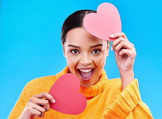 Image showing Paper heart, excited woman and portrait on blue background, studio and emoji icon. Happy female model, love and shape of sign, surprise and celebration of peace, thank you and kindness for valentines