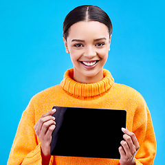 Image showing Tablet, mockup and smile with portrait of woman in studio for website, technology and social media. Networking, internet and connection with female on blue background for app, announcement and search