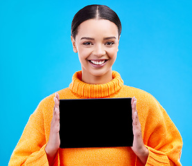 Image showing Tablet, mockup and portrait of woman in studio for website, technology and social media news. Networking, internet and connection with female on blue background for app, announcement and search