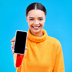 Image showing Phone, mockup and portrait of woman in studio for website, technology and social media news. Networking, internet and connection with female on blue background for app, logo and search