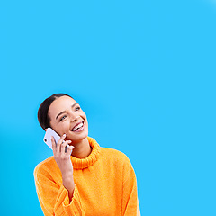 Image showing Laugh, mockup and woman on phone in studio with happiness and a smile from talk. Happy, isolated, and blue background and a young female and gen z model laughing on a mobile web conversation