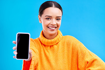 Image showing Phone, mockup and smile with portrait of woman in studio for website, technology and social media. Networking, internet and connection with female on blue background for app, announcement and search